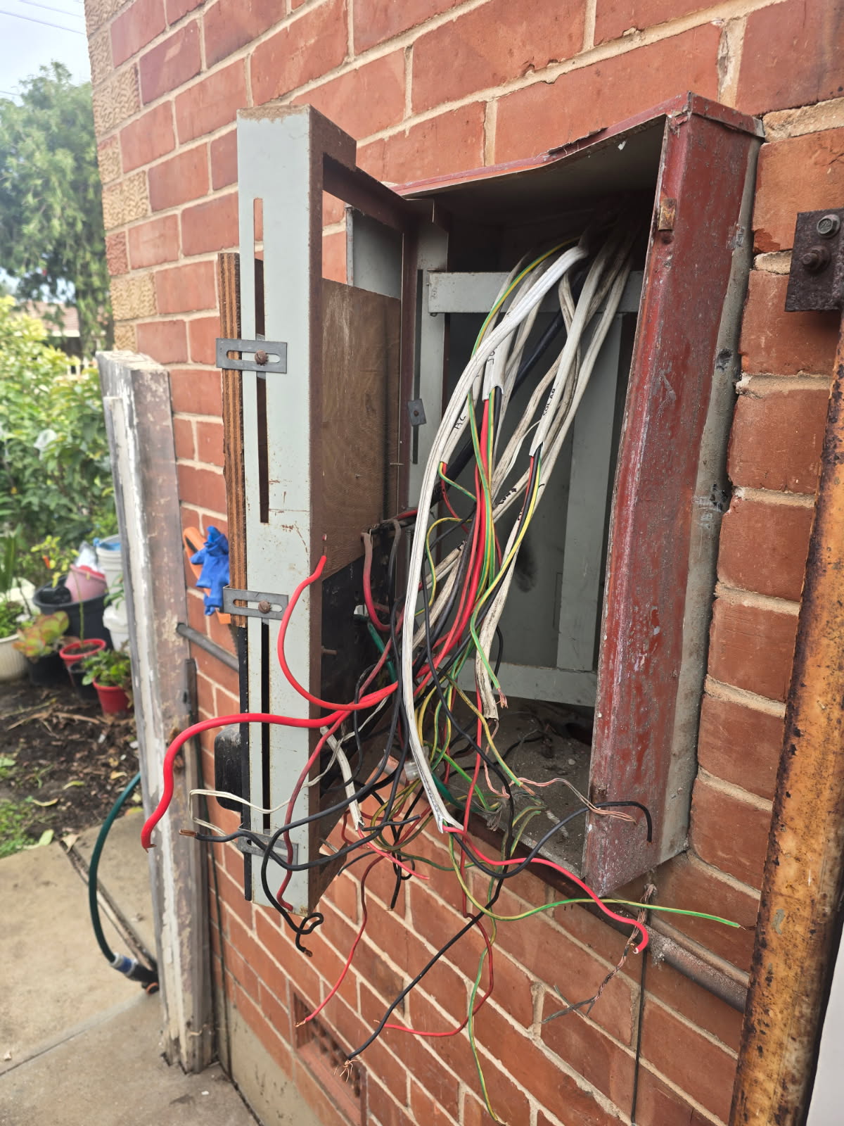 Open switchboard showing exposed wiring during a rewire